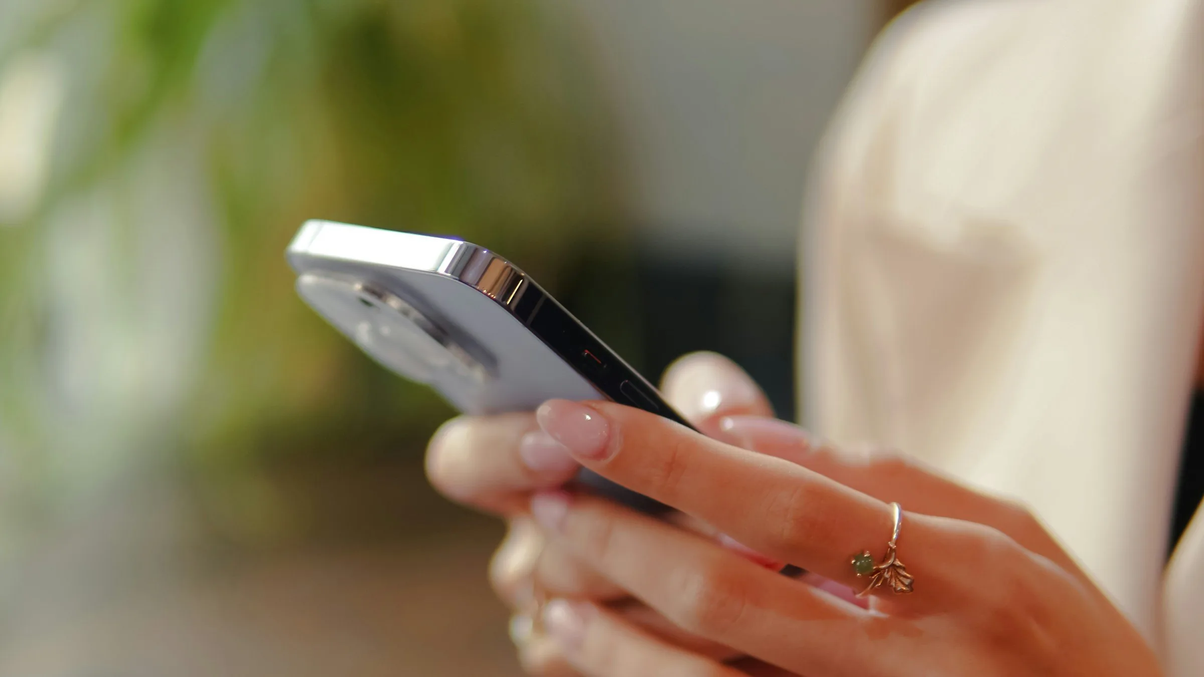A close-up of a phone held in both hands